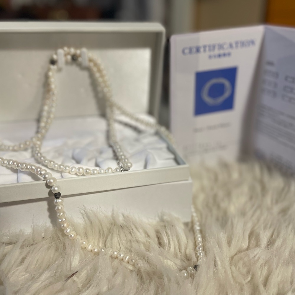 Pearl (Fresh water) weight 80.1g, size of pearls 6.0-7.5mm, 50’ long white color